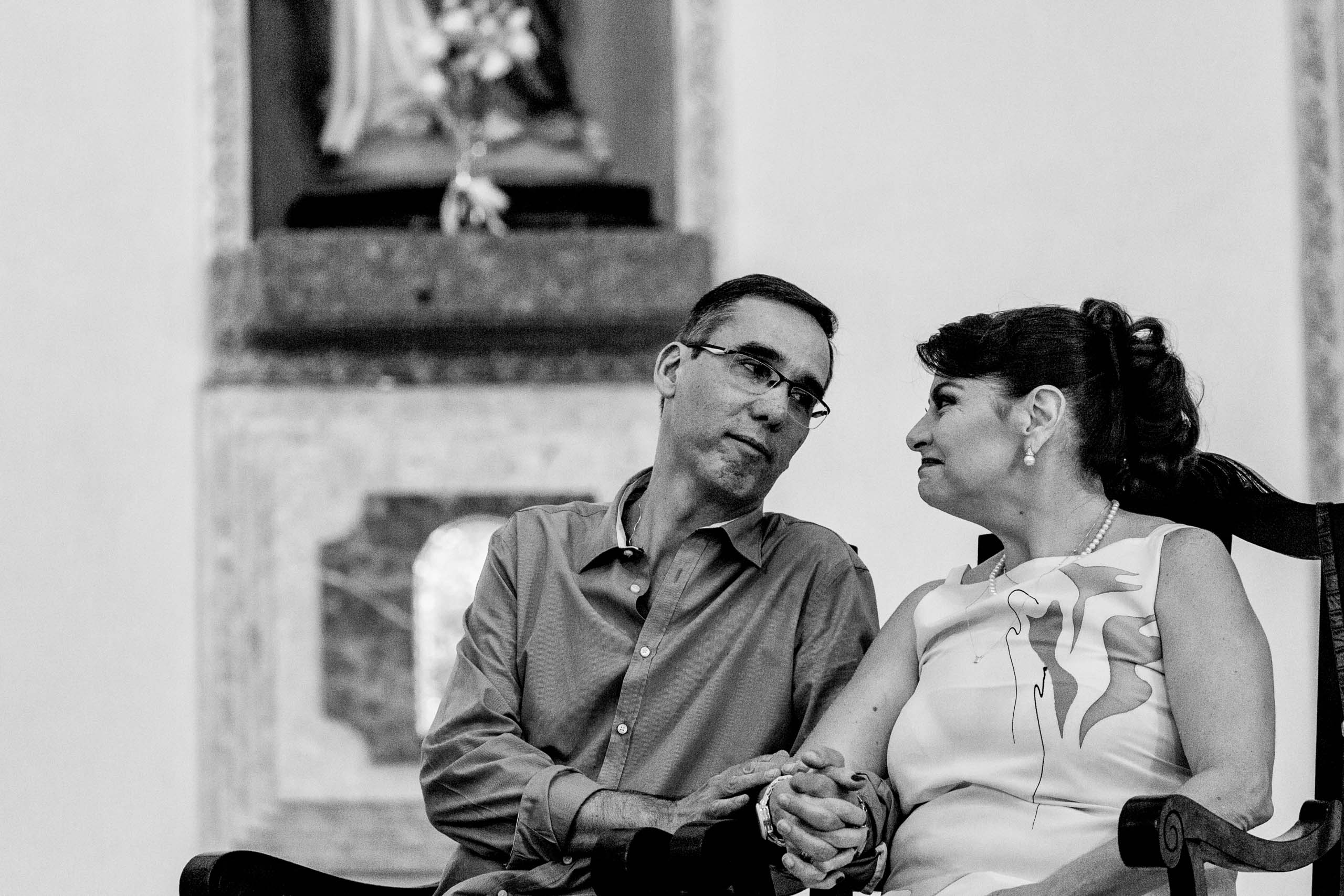Couple sharing an emotional moment during a wedding anniversary celebration.